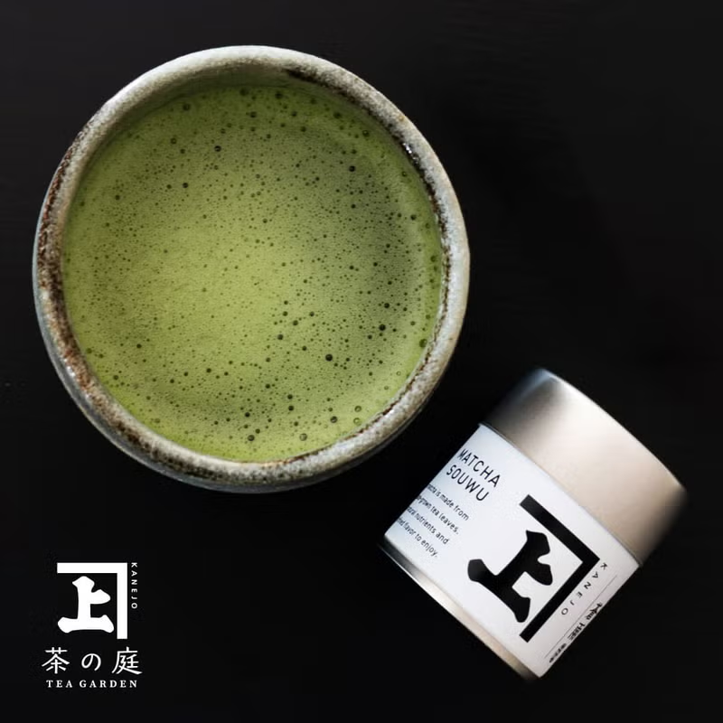 Ceremonial matcha in a handcrafted ceramic bowl with a tin