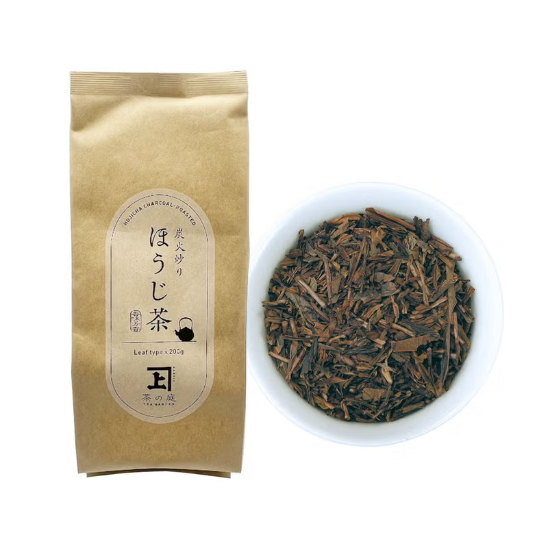 Kraft bag of Kakegawa hojicha next to a bowl of roasted leaves